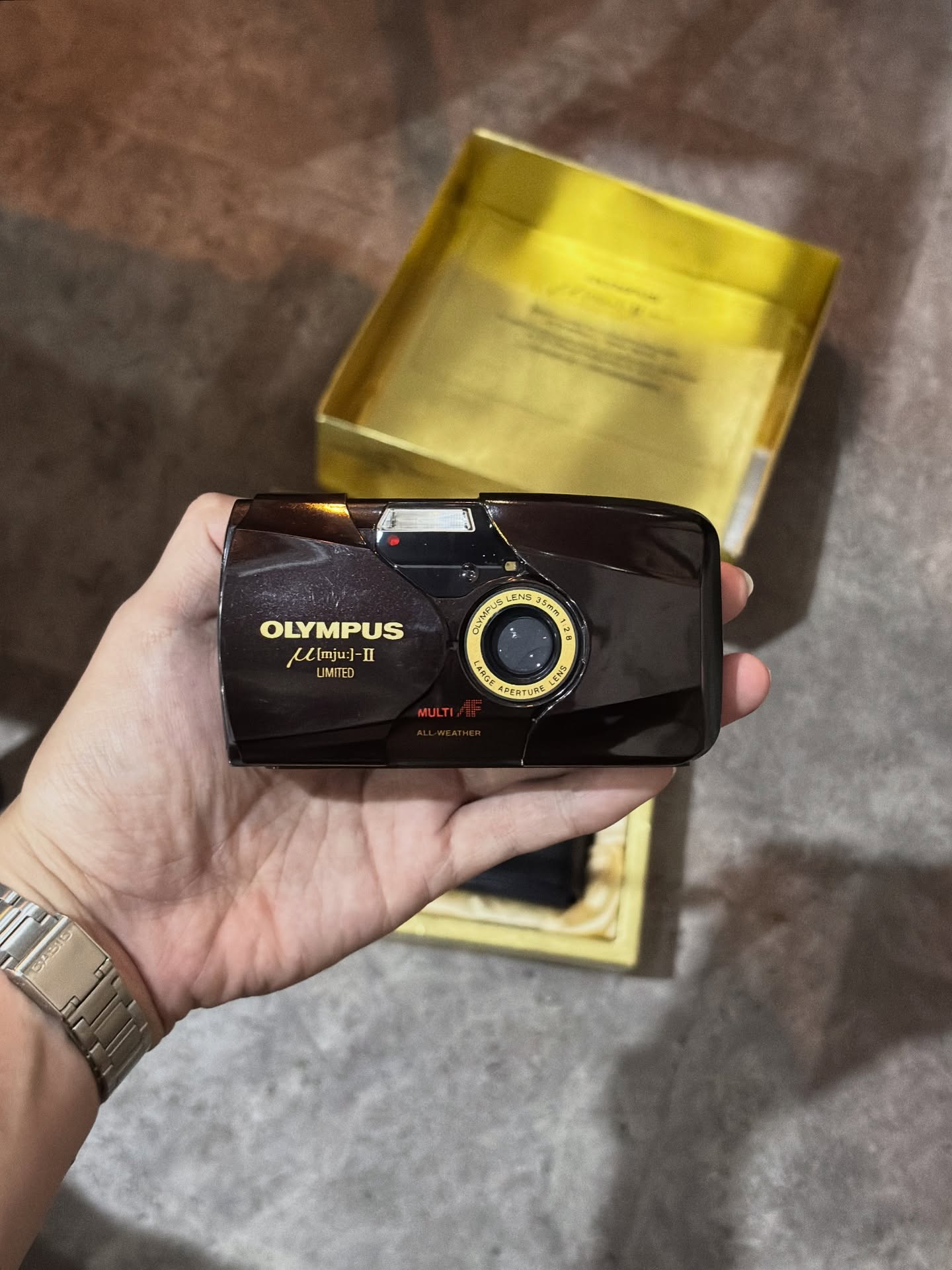 Black compact camera with case
